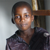 Bongani posing in his room